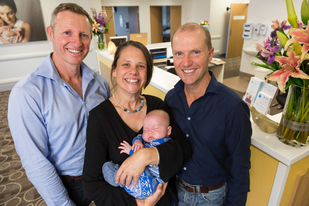  Rob Brunker and Jesse Zischke with surrogate Jane Miller and baby Lachlan